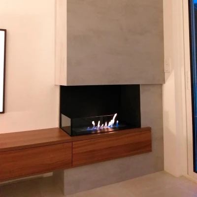 Foco Corner Left 800- Left sided corner bioethanol fireplace Foco Corner Left 800 - Modern left-sided corner bioethanol fireplace with sleek black design and tempered glass.