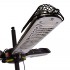 Black electric patio heater mounted on a parasol